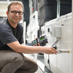 Technician performs on-site calibration on equipment