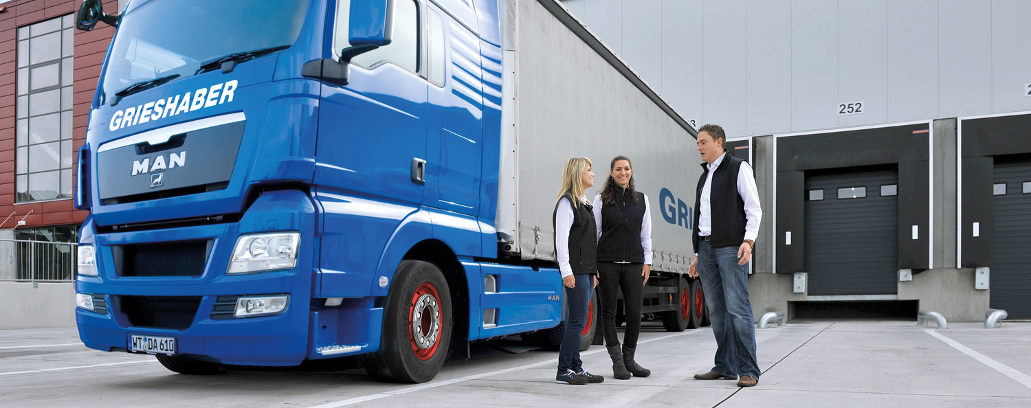 Truck of the Grieshaber Logistics Group in front of the logistics centre