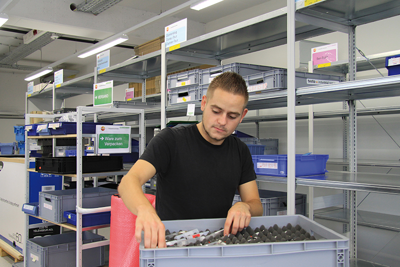 Employee packs test equipment in a chute