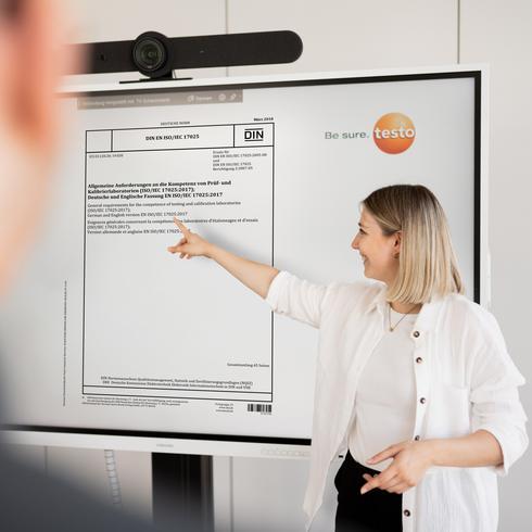 A woman explains the accreditation preparation process.